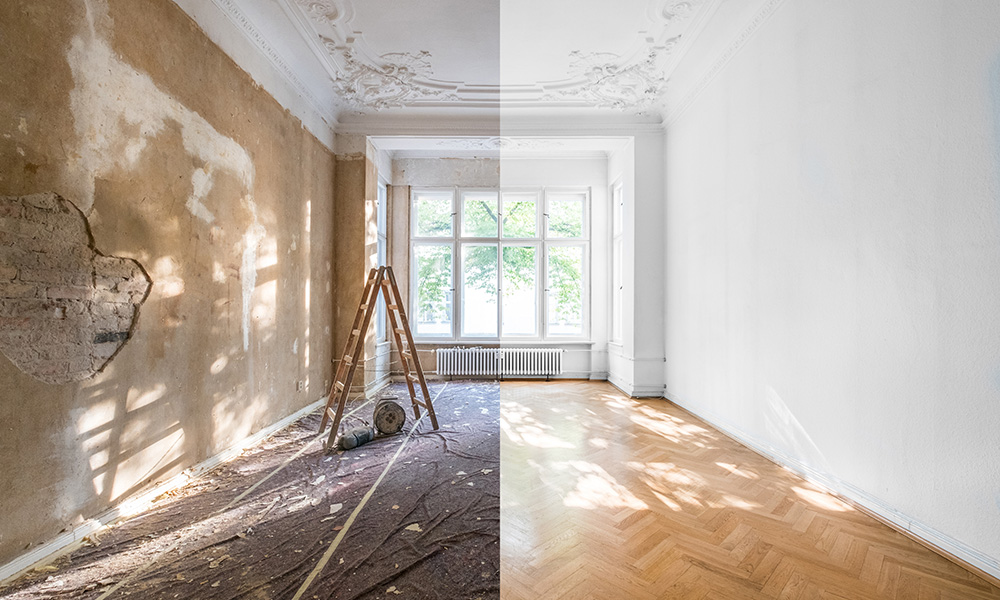 Before and after of an empty room | left side showing drop cloths, broken walls, and ladder, right side showing chevron natural wood floors, restored white walls.